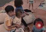 Image of ethnic Vietnamese fleeing Cambodia Vung Tau Vietnam, 1970, second 42 stock footage video 65675070855