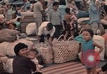 Image of ethnic Vietnamese fleeing Cambodia Vung Tau Vietnam, 1970, second 46 stock footage video 65675070855