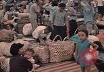 Image of ethnic Vietnamese fleeing Cambodia Vung Tau Vietnam, 1970, second 47 stock footage video 65675070855