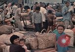 Image of ethnic Vietnamese fleeing Cambodia Vung Tau Vietnam, 1970, second 50 stock footage video 65675070855