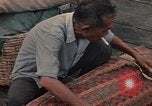 Image of ethnic Vietnamese fleeing Cambodia Vung Tau Vietnam, 1970, second 55 stock footage video 65675070855