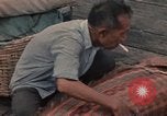 Image of ethnic Vietnamese fleeing Cambodia Vung Tau Vietnam, 1970, second 56 stock footage video 65675070855
