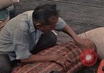 Image of ethnic Vietnamese fleeing Cambodia Vung Tau Vietnam, 1970, second 58 stock footage video 65675070855