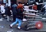 Image of looting of Wolfe Bros. furniture store during riots Washington DC USA, 1968, second 23 stock footage video 65675070916