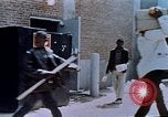 Image of looting of Wolfe Bros. furniture store during riots Washington DC USA, 1968, second 47 stock footage video 65675070916