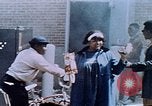 Image of looting of Wolfe Bros. furniture store during riots Washington DC USA, 1968, second 55 stock footage video 65675070916
