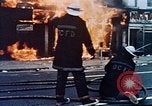 Image of burning building in riot after death of Martin Luther King Jr Washington DC USA, 1968, second 13 stock footage video 65675070919