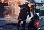 Image of burning building in riot after death of Martin Luther King Jr Washington DC USA, 1968, second 14 stock footage video 65675070919