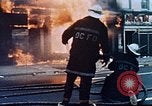 Image of burning building in riot after death of Martin Luther King Jr Washington DC USA, 1968, second 15 stock footage video 65675070919