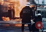 Image of burning building in riot after death of Martin Luther King Jr Washington DC USA, 1968, second 16 stock footage video 65675070919