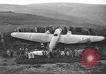 Image of Sightseers  surround downed German Heinkel He-111bomber Scotland United Kingdom, 1939, second 9 stock footage video 65675070948