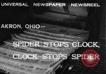 Image of spider in clock Akron Ohio USA, 1932, second 5 stock footage video 65675070961