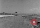 Image of American paratroopers jump from airplanes in Korean War Korea, 1952, second 28 stock footage video 65675070966