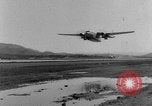 Image of American paratroopers jump from airplanes in Korean War Korea, 1952, second 33 stock footage video 65675070966