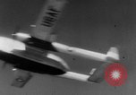 Image of American paratroopers jump from airplanes in Korean War Korea, 1952, second 37 stock footage video 65675070966