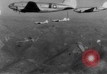 Image of American paratroopers jump from airplanes in Korean War Korea, 1952, second 45 stock footage video 65675070966