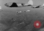 Image of American paratroopers jump from airplanes in Korean War Korea, 1952, second 46 stock footage video 65675070966