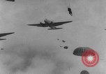 Image of American paratroopers jump from airplanes in Korean War Korea, 1952, second 59 stock footage video 65675070966