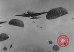 Image of American paratroopers jump from airplanes in Korean War Korea, 1952, second 60 stock footage video 65675070966