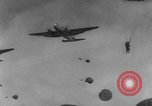 Image of American paratroopers jump from airplanes in Korean War Korea, 1952, second 61 stock footage video 65675070966