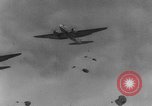 Image of American paratroopers jump from airplanes in Korean War Korea, 1952, second 62 stock footage video 65675070966