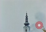 Standbild Gramastetten Österreich Kirche Markt Bereich in Brand Gramastetten Österreich, 1945, aus Sekunde 54 historischem Filmmaterial Videoclip 65675070987