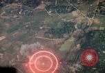 Image of air strikes on road intersection Vietnam, 1967, second 3 stock footage video 65675071012