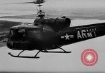 Image of Viet Cong attack U.S.soldiers in crashed helicopter Vietnam, 1965, second 4 stock footage video 65675071042