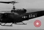 Image of Viet Cong attack U.S.soldiers in crashed helicopter Vietnam, 1965, second 5 stock footage video 65675071042