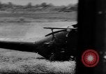 Image of Viet Cong attack U.S.soldiers in crashed helicopter Vietnam, 1965, second 12 stock footage video 65675071042