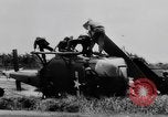 Image of Viet Cong attack U.S.soldiers in crashed helicopter Vietnam, 1965, second 16 stock footage video 65675071042