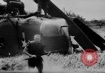 Image of Viet Cong attack U.S.soldiers in crashed helicopter Vietnam, 1965, second 17 stock footage video 65675071042