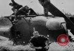 Image of Viet Cong attack U.S.soldiers in crashed helicopter Vietnam, 1965, second 18 stock footage video 65675071042