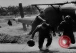 Image of Viet Cong attack U.S.soldiers in crashed helicopter Vietnam, 1965, second 20 stock footage video 65675071042