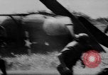 Image of Viet Cong attack U.S.soldiers in crashed helicopter Vietnam, 1965, second 22 stock footage video 65675071042