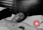 Image of Viet Cong attack U.S.soldiers in crashed helicopter Vietnam, 1965, second 33 stock footage video 65675071042