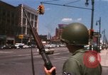 Image of United States soldiers on Guard duty in City Detroit Michigan USA, 1967, second 16 stock footage video 65675071096