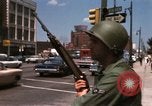 Image of United States soldiers on Guard duty in City Detroit Michigan USA, 1967, second 42 stock footage video 65675071096