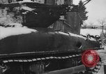 Image of US Soldiers examine damaged US M4 and German Panther tank Sterpigny Belgium, 1945, second 14 stock footage video 65675071156