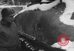 Image of US Soldiers examine damaged US M4 and German Panther tank Sterpigny Belgium, 1945, second 17 stock footage video 65675071156