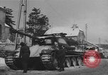 Image of US Soldiers examine damaged US M4 and German Panther tank Sterpigny Belgium, 1945, second 38 stock footage video 65675071156