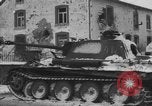 Image of US Soldiers examine damaged US M4 and German Panther tank Sterpigny Belgium, 1945, second 44 stock footage video 65675071156