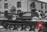 Image of US Soldiers examine damaged US M4 and German Panther tank Sterpigny Belgium, 1945, second 45 stock footage video 65675071156