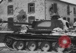 Image of US Soldiers examine damaged US M4 and German Panther tank Sterpigny Belgium, 1945, second 46 stock footage video 65675071156