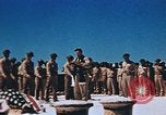 Image of Religious services at a bomb crater on Midway Island Pacific Ocean, 1942, second 25 stock footage video 65675071189