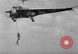 Image of Marilyn Rich stunt on rings New York City USA, 1951, second 23 stock footage video 65675071433