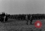 Image of German troops marching on a rough field Germany, 1933, second 4 stock footage video 65675071553