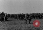Image of German troops marching on a rough field Germany, 1933, second 5 stock footage video 65675071553