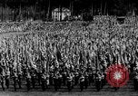 Image of German troops marching on a rough field Germany, 1933, second 22 stock footage video 65675071553