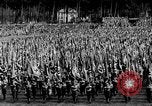 Image of German troops marching on a rough field Germany, 1933, second 23 stock footage video 65675071553